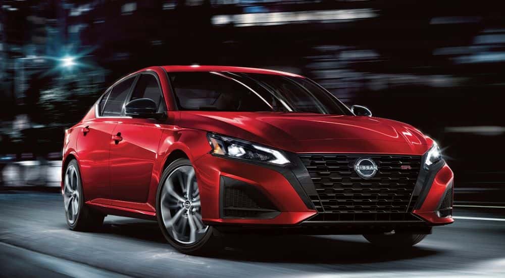 A red 2026 Nissan Altima SR shown driving in a city.
