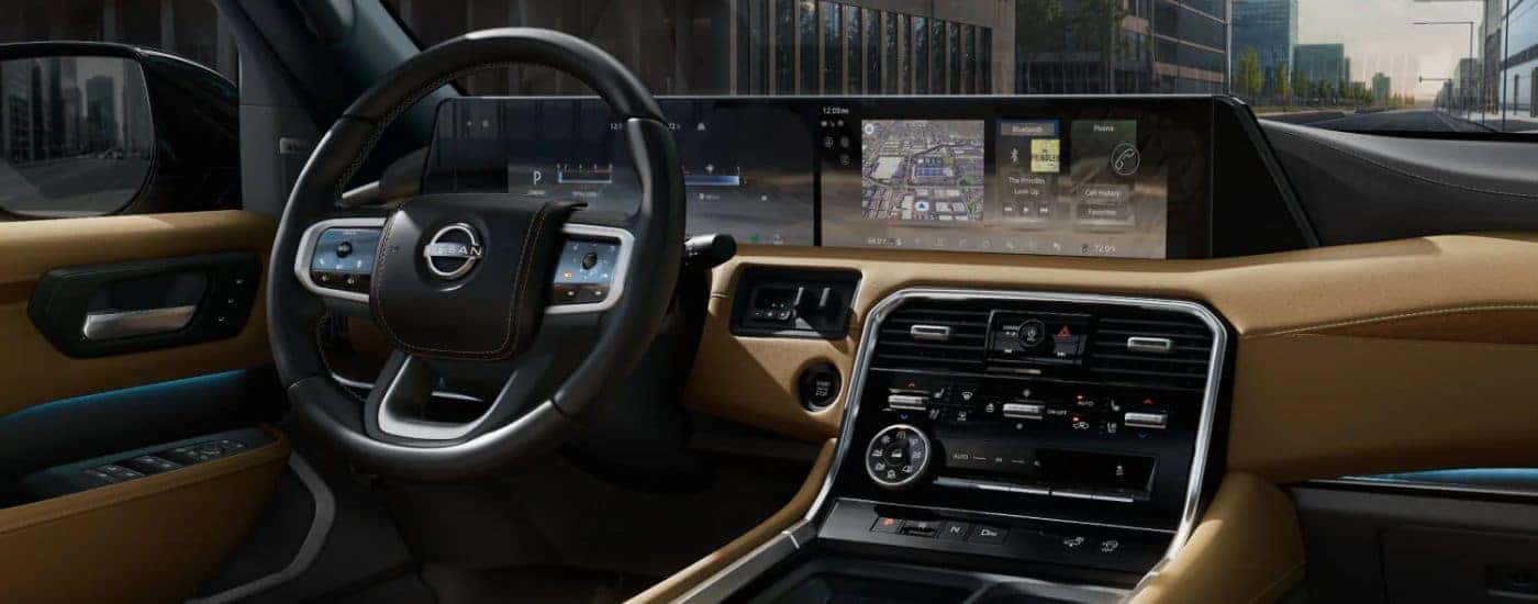 Infotainment display and steering wheel on a 2026 Nissan Armada Platinum Reserve.