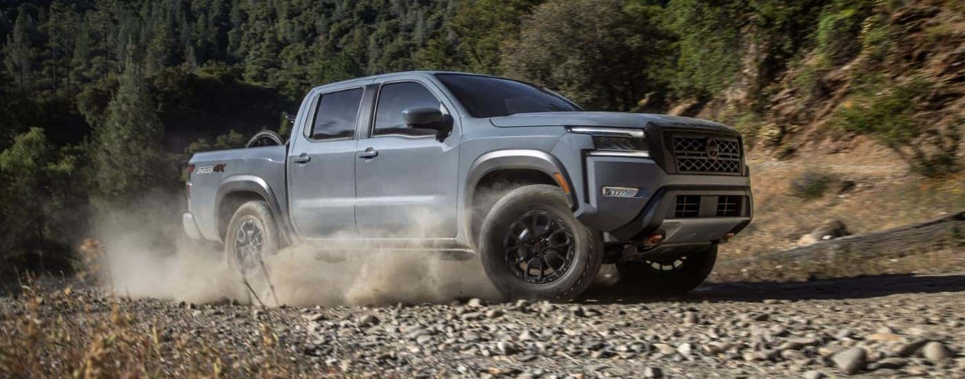 Grey 2022 Nissan Frontier PRO-4X driving off-road
