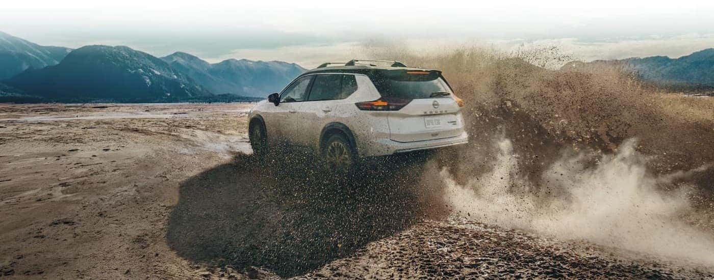 A white 2026 Nissan Rogue off-roading.