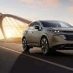 A silver 2026 Nissan Murano driving on a bridge.