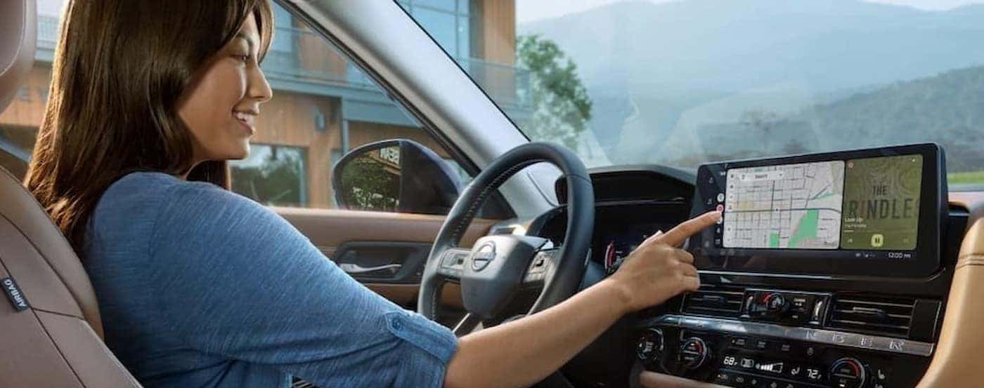 A person driving in a 2026 Nissan Pathfinder.