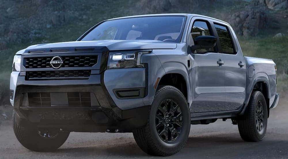 A gray 2026 Nissan Frontier Dark Armor parked offrad.