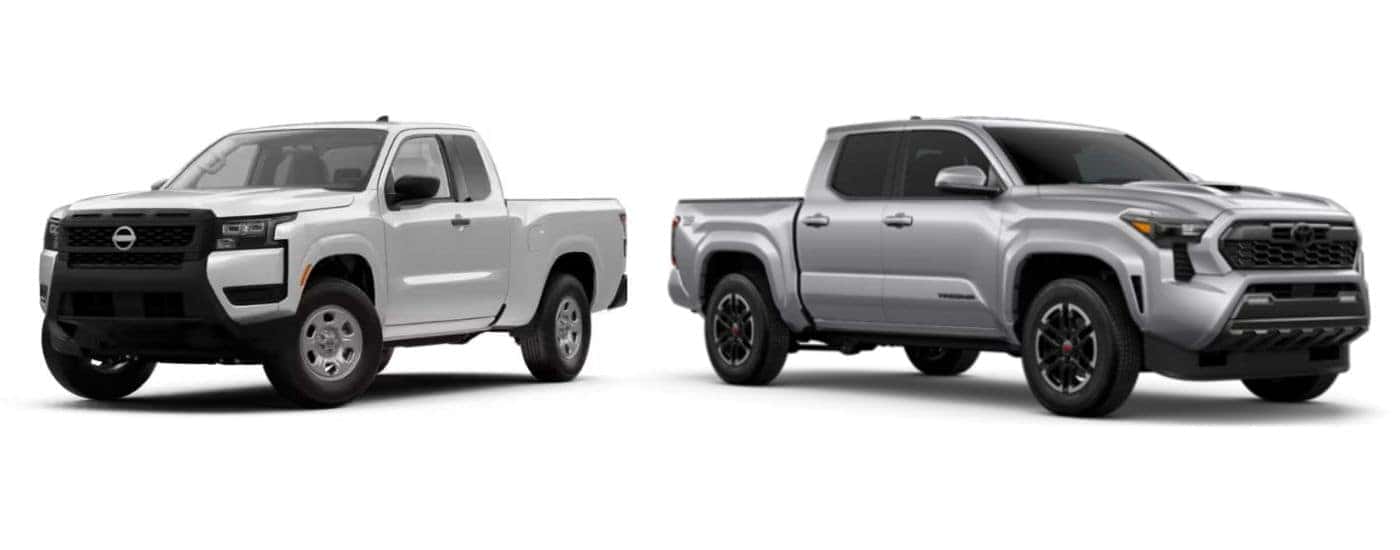 White 2026 Nissan Frontier angled left and a grey 2026 Toyota Tacoma angled right.
