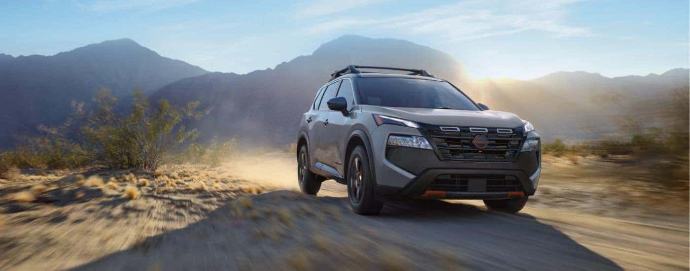 A gray 2026.5 Nissan Rogue Rock Creek shown driving off-road.