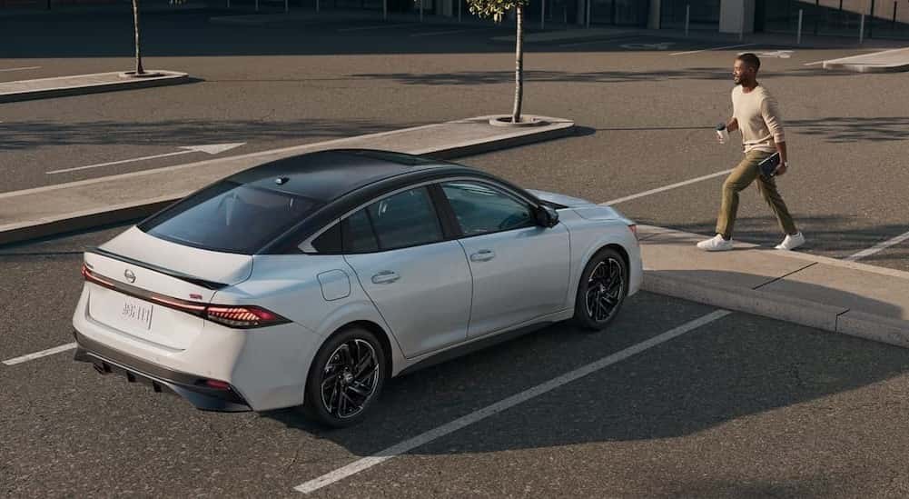 A white 2026 Nissan Sentra parked near a person.