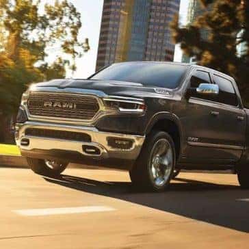 2019 Ram 1500 drives down city street