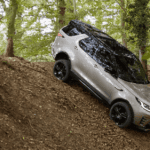 A 2024 Discovery shows off its capability as a luxury SUV.
