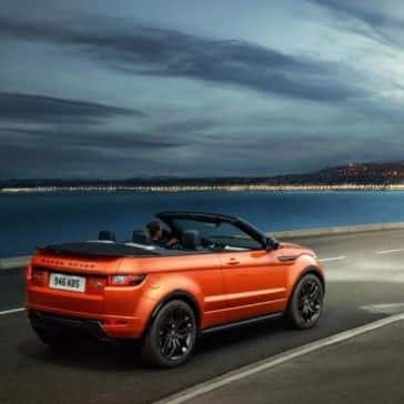 2017 Land Rover Range Rover Evoque Convertible driving on highway next to ocean