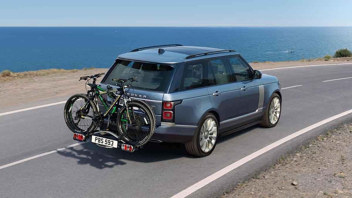 2018 Land Rover Range Rover driving with bikes on rack