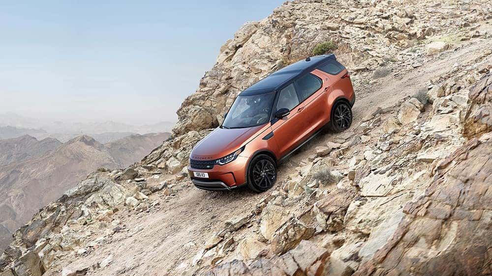 2019 Land Rover Discovery Off-Roading Down a Rock Mountain