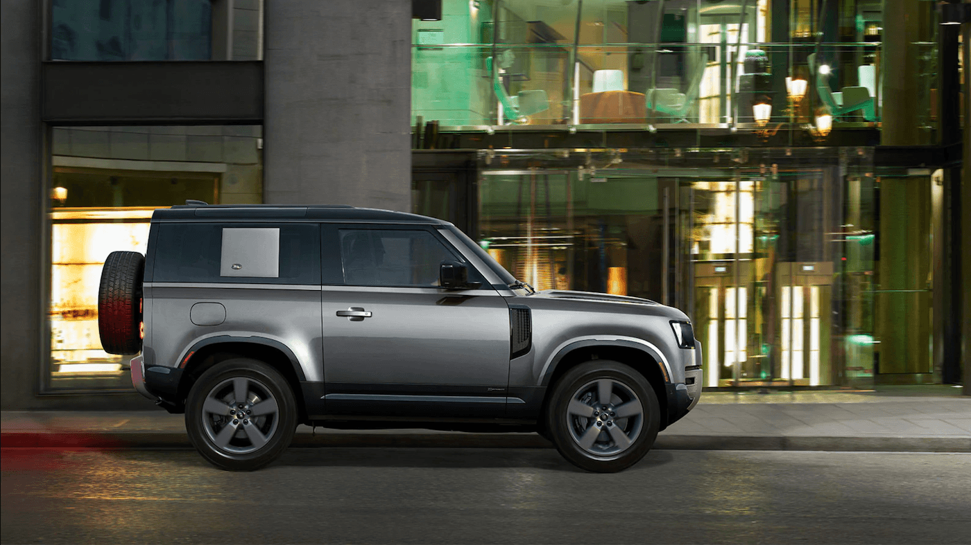 The 2021 Land Rover Defender 90 driving in the city.