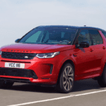 The 2021 Land Rover Discovery Sport driving on a highway.