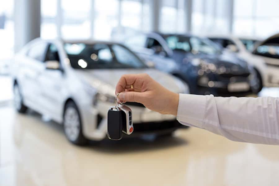 Keys being handed over at car dealership