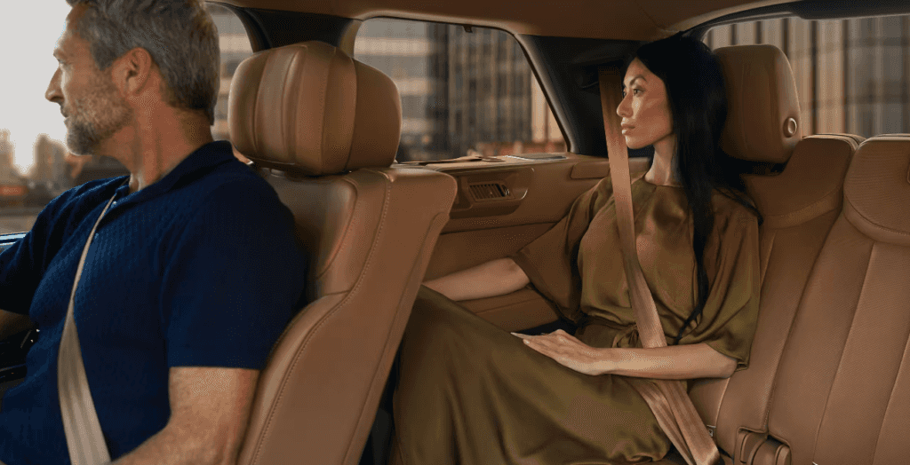 Passengers show in the front seat and rear seat of the 2024 Range Rover