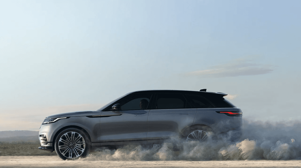 Side profile of the 2025 Range Rover Velar on a dusty road