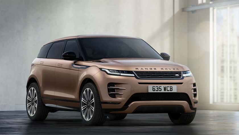 A brown Range Rover Velar parked indoors.