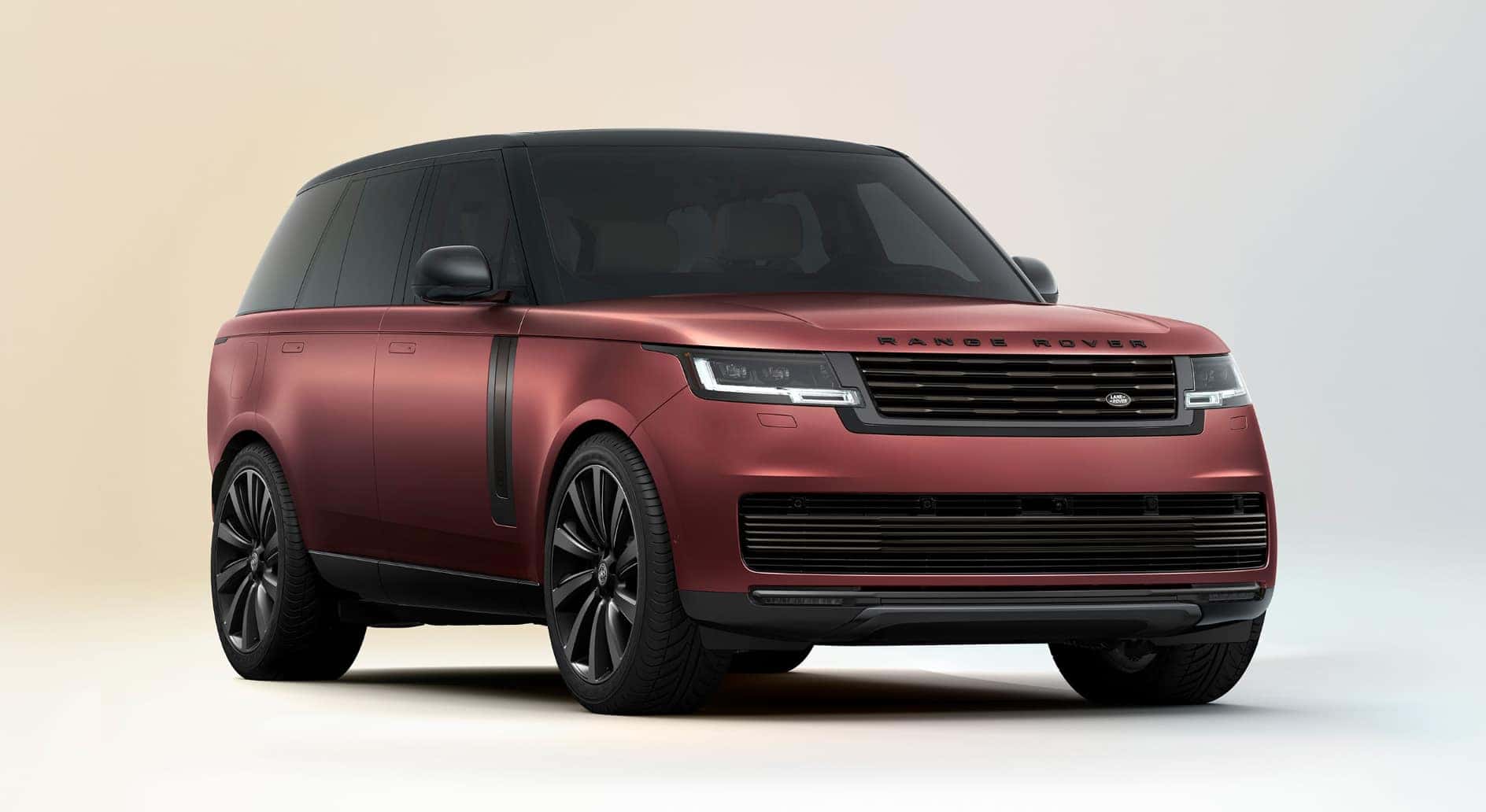 A red 2026 Range Rover on display.