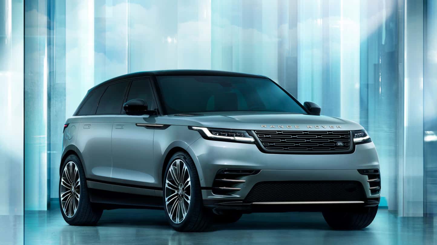 A light blue Range Rover Velar on display.