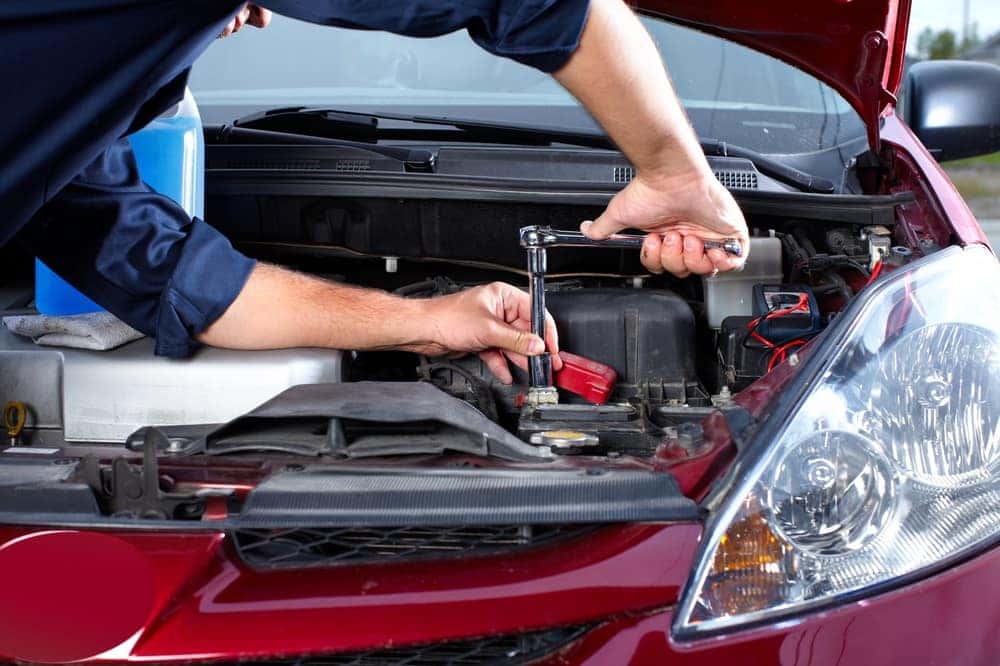 Mechanic Working on Car