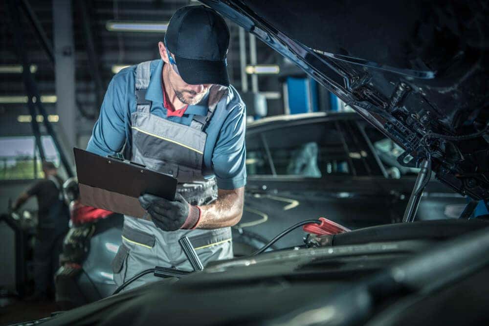 Mechanic Working on Car