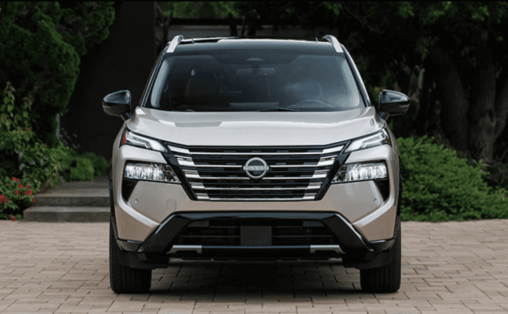 Front of a parked beige 2025 Nissan Rogue