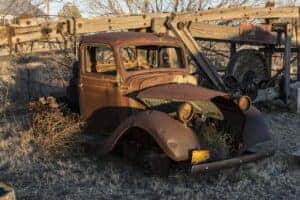 Very old, rusted out truck that is falling apart