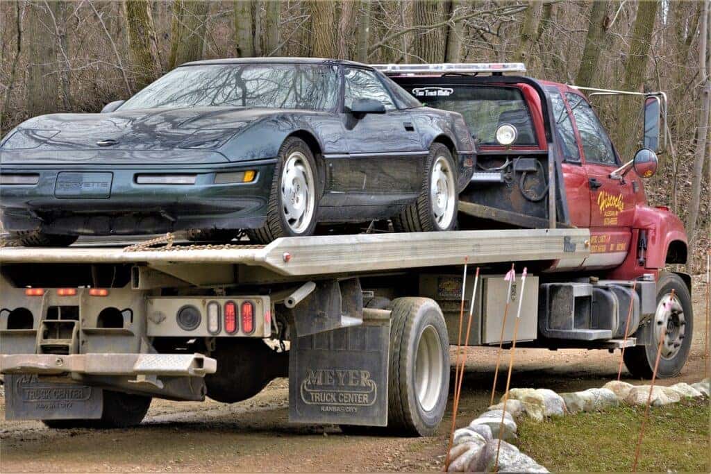 Car being towed away on a truck