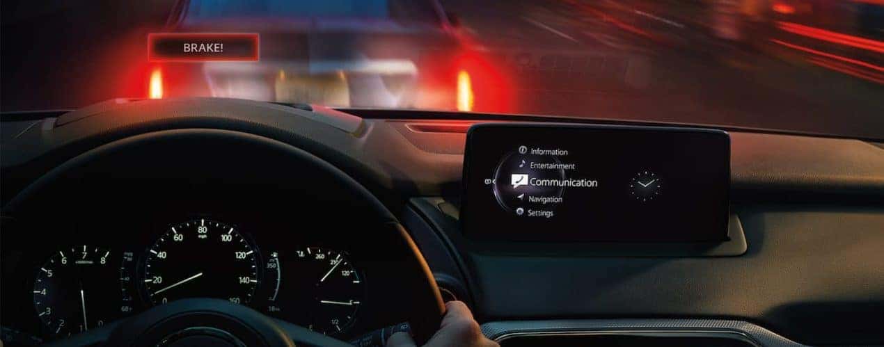 The emergency brake warning shows on the HUD in a 2022 Mazda CX-9.