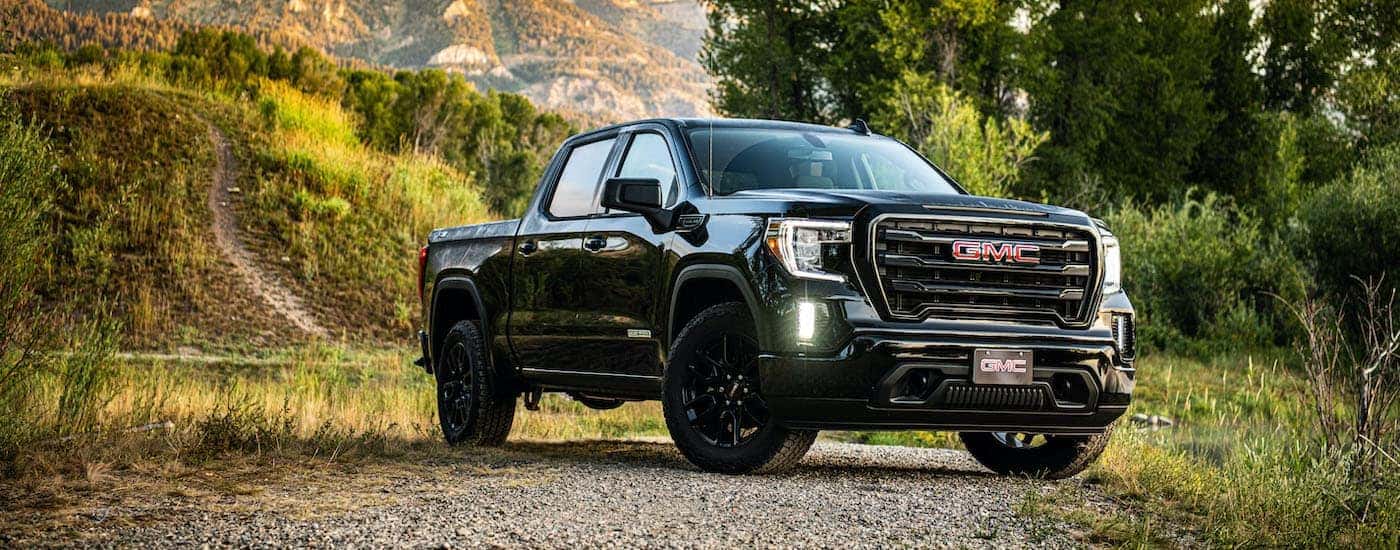 A black 2020 GMC Sierra SLE Elevation is shown parked on a trail.