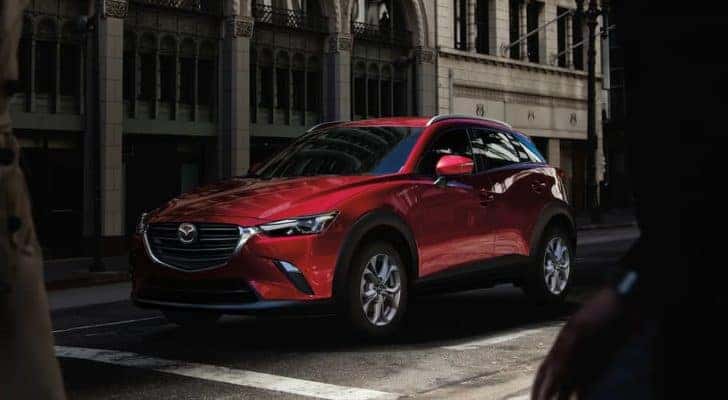 A red 2020 Mazda CX-3 is shown on a city street after visiting a Lake Murray Mazda dealer.