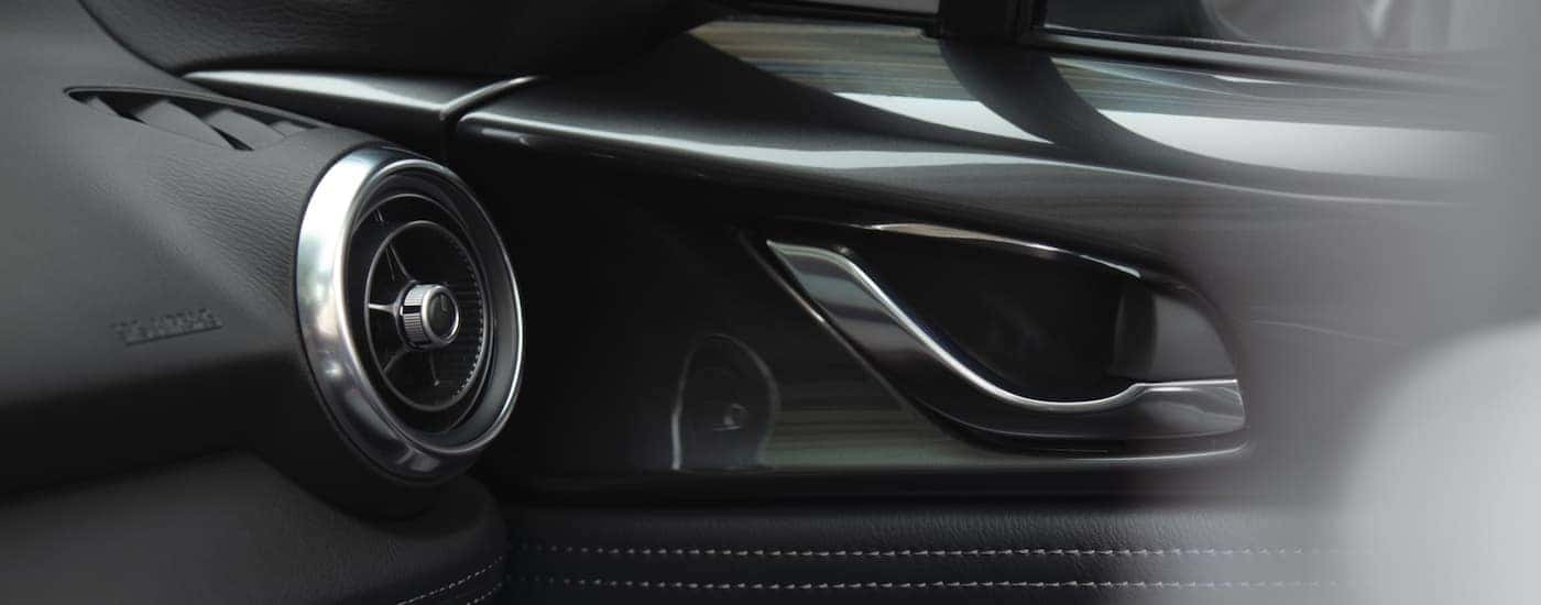 A close up shows interior details in a 2022 Mazda MX-5 Miata.