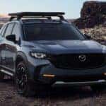 A blue 2023 Mazda CX-50 is shown from the front.
