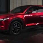 A popular used Mazda dealer near Chapin, SC, a red 2018 Mazda CX-5, is shown from the side.