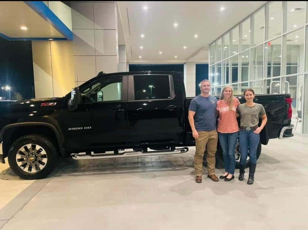 People standing in front of truck