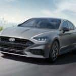 The 2021 Hyundai Sonata leaving a city in the daytime.