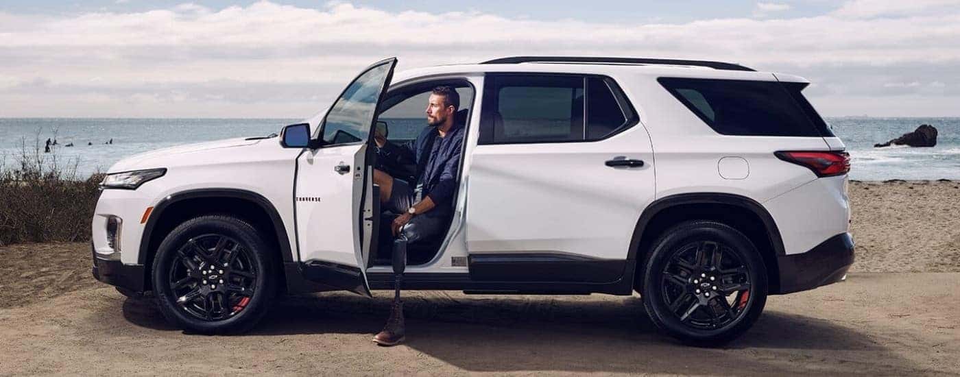 A white 2023 Chevy Traverse Redline is shown from the side.