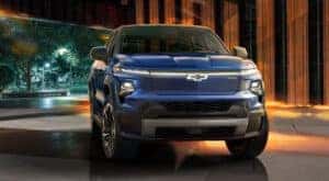 A blue 2024 Chevy Silverado EV RST is shown from the front after leaving a Chevy dealer near Concord.