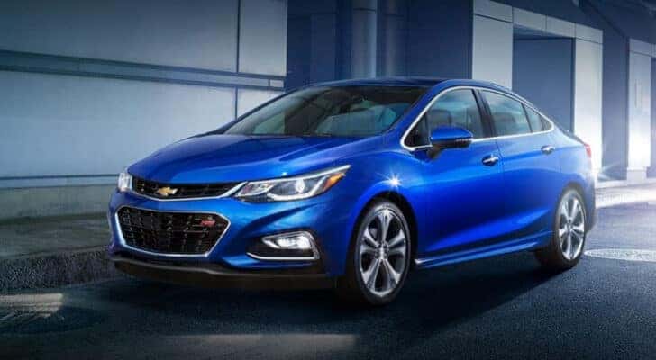 A blue 2017 Chevy Cruze RS is shown parked on pavement.