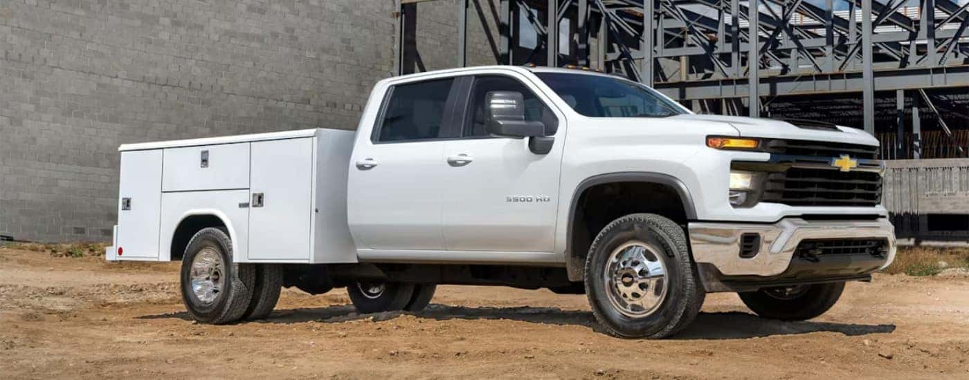 White 2024 Chevy Silverado 3500 HD Chassis Cab parked on a construction site
