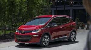 A red 2020 Chevy Bolt EV is shown after leaving a Chevy dealer near Mooresville.