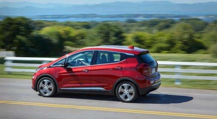 A red 2020 Chevy Bolt EV is shown from the side.