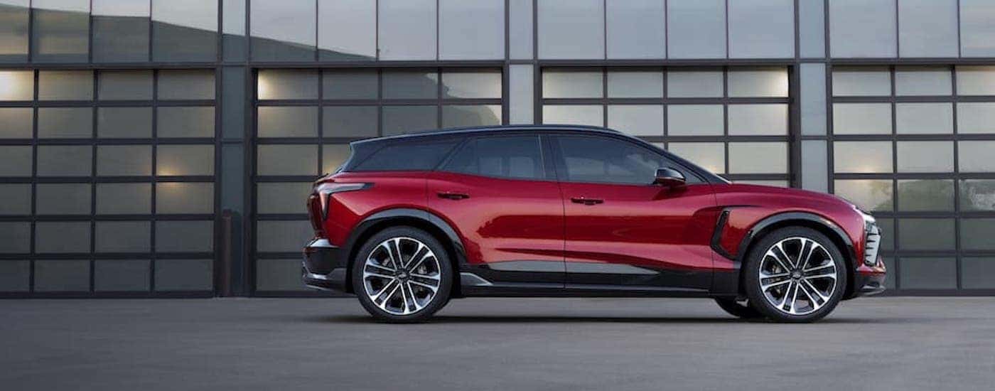 A red 2024 Chevy Blazer EV RS is shown from the side.