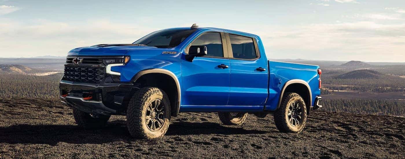 A blue 2025 Chevy Silverado ZR2 parked offroad.