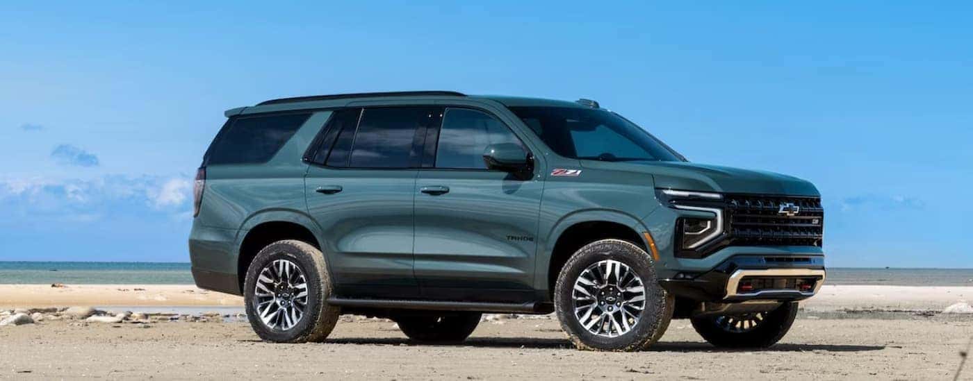 A green 2025 Chevy Tahoe Z71 parked offroad.