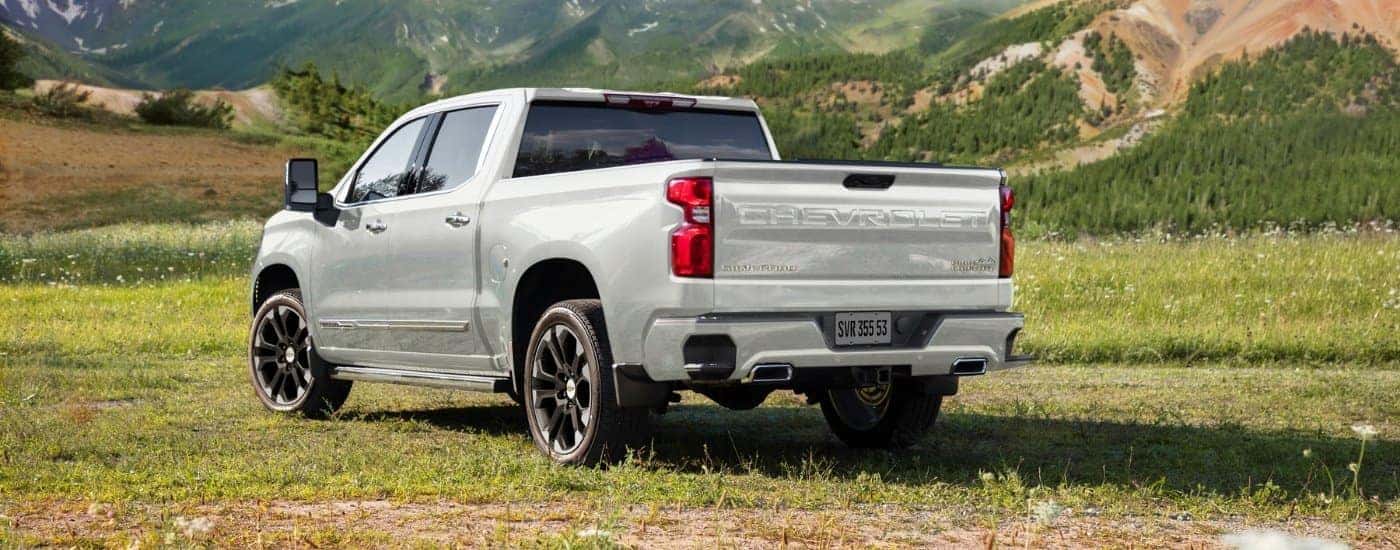A white 2025 Chevy Silverado 1500 for sale in Huntersville from the rear at an angle.