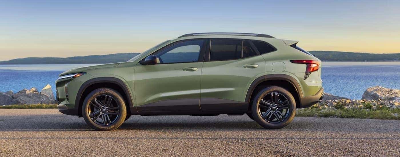 A green 2025 Chevy Trax ACTIV parked near water.