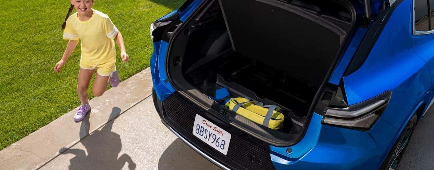 A blue 2025 Chevy Equinox EV trunk opening.
