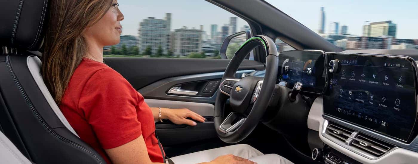 Woman using the Super Cruise feature in a 2025 Chevy Equinox EV