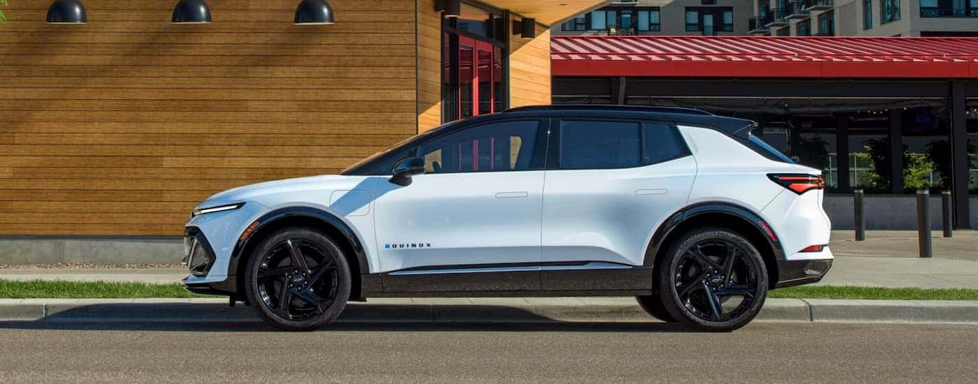 White 2025 Chevy Equinox EV RS for sale near Kannapolis on a city street
